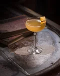 Bronx Cocktail with an orange twist on old books