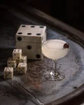 Casino Cocktail with a cherry beside dice