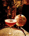 L'Aiglon Screaming cocktail with a rosemary garnish