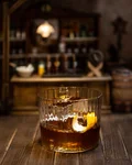 Monkey Old Fashioned on ice in a miniature saloon setting
