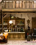 Sloe Negroni on ice in a miniature saloon setting