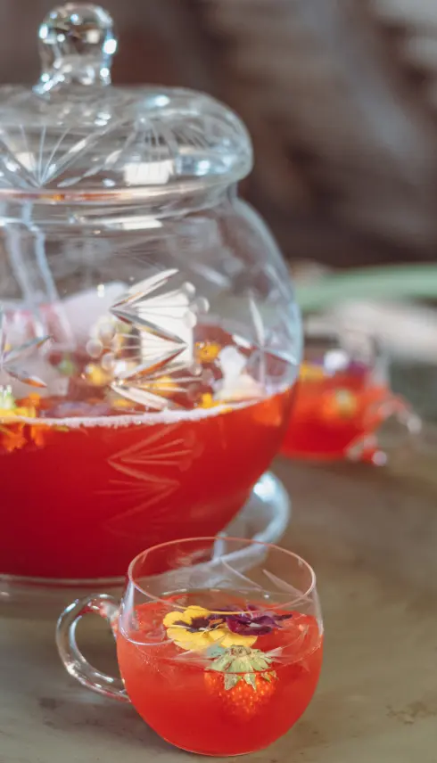 The "Nearby" Punch in a glass teapot with cups
