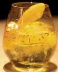 The Yellow Monkey cocktail with an orange peel