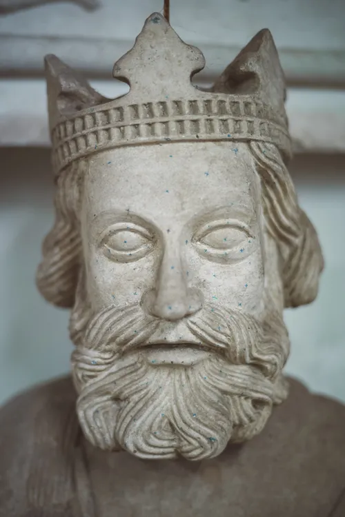 Carved stone head of a crowned king