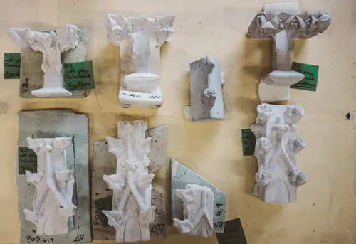 Plaster casts of ornamental stone details on a wall