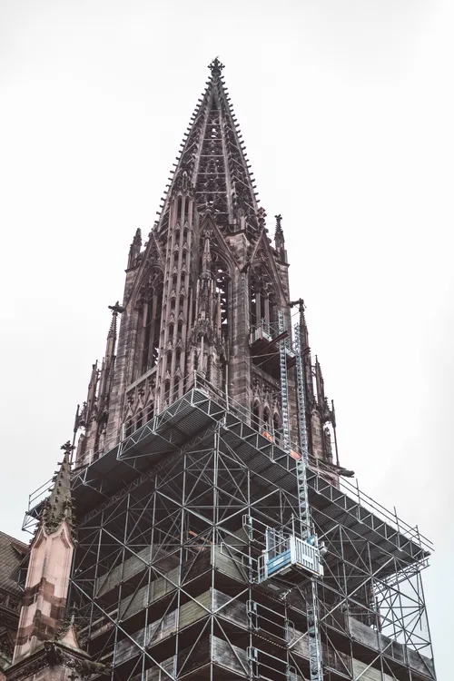 Gothic cathedral spire under scaffolding