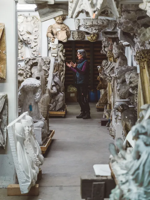 Stonemason's workshop filled with stone figures and casts