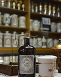 Monkey 47 bottle and apothecary jars in a pharmacy museum
