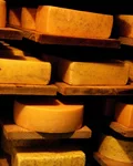 Wheels of cheese on shelves in the Chäs-Chuchi