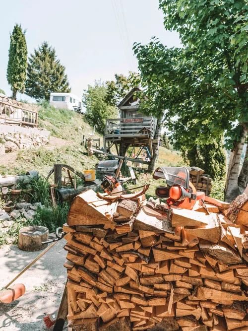 Stacked firewood with a shingle maker's machine