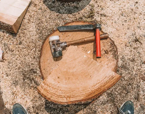 Wooden mallets resting on a sawn log