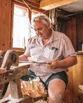Shingle maker working at his bench in the workshop
