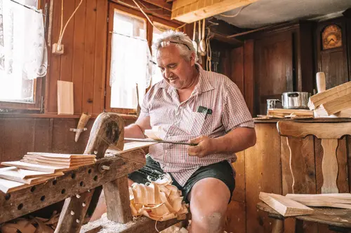Shingle maker working at his bench in the workshop